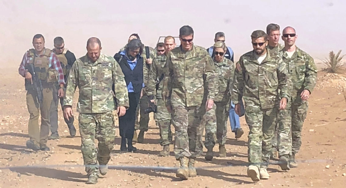 U.S. Gen. Joseph Votel (center), the top U.S. commander for the Middle East, visited a military outpost at al-Tanf in southern Syria, where the U.S. trains Syrian opposition forces, in October. President Trump is planning to withdraw the U.S. forces from Syria, according to a Pentagon official. Lolita Baldor/AP