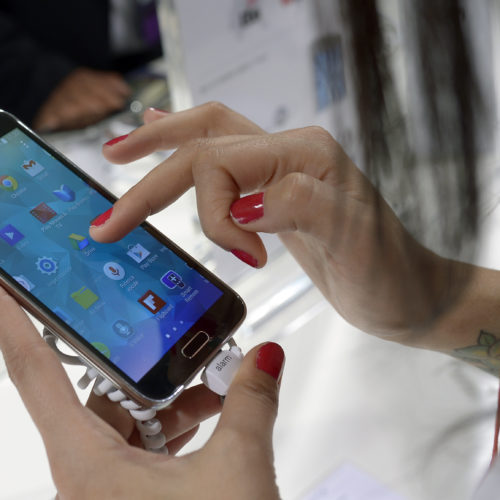 A Samsung Galaxy S5 is demonstrated at the Mobile World Congress, the world's largest mobile phone trade show in Barcelona, Spain. CREDIT: FERNANDEZ/AP