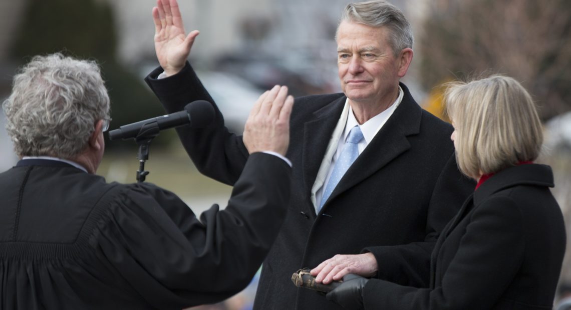 Brad Little was sworn in as Idaho's governor Friday, Jan. 4, 2019, with his wife Teresa Little holding a Bible. CREDIT: OTTO KITSINGER/AP