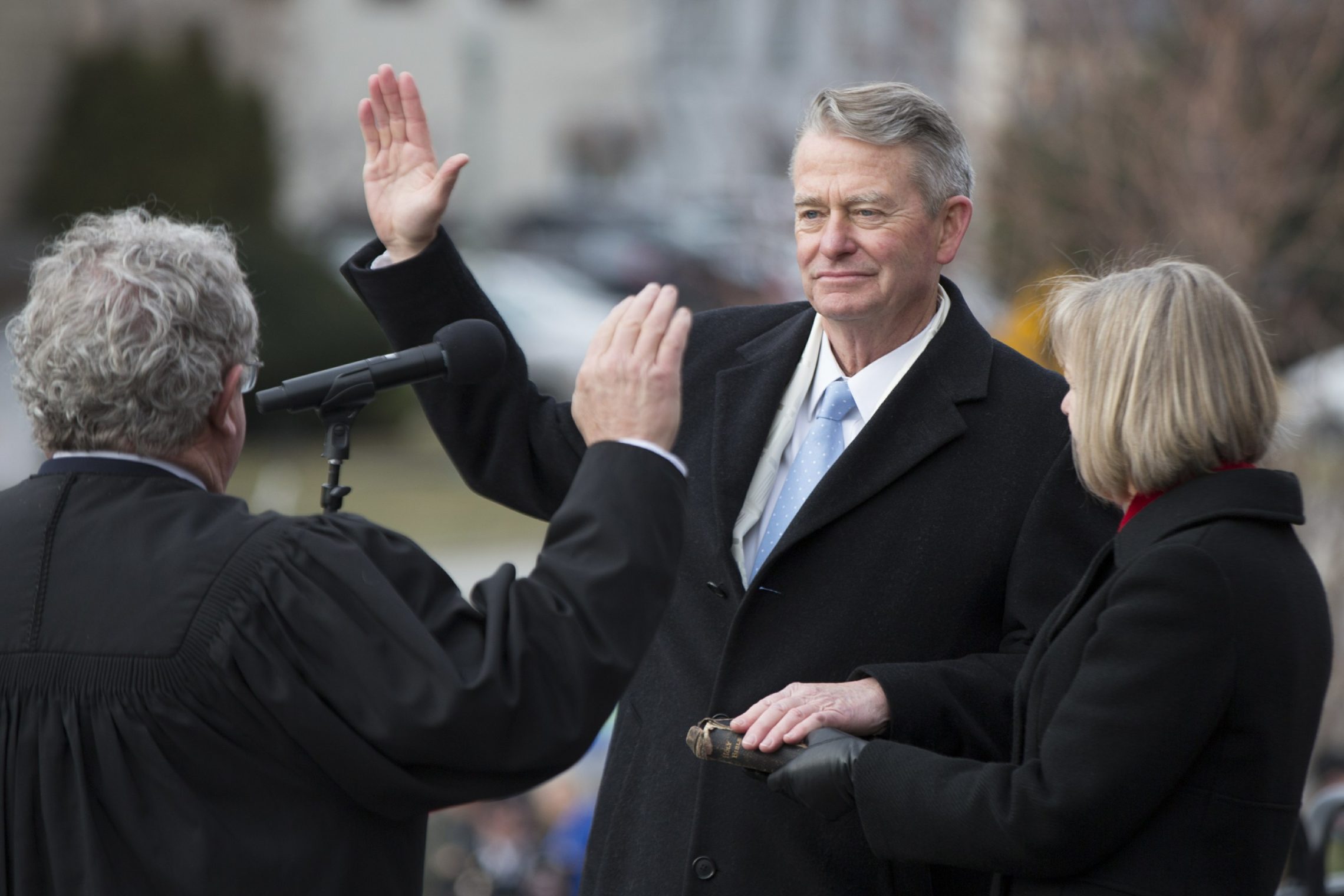 Brad Little was sworn in as Idaho's governor Friday, Jan. 4, 2019, with his wife Teresa Little holding a Bible. CREDIT: OTTO KITSINGER/AP