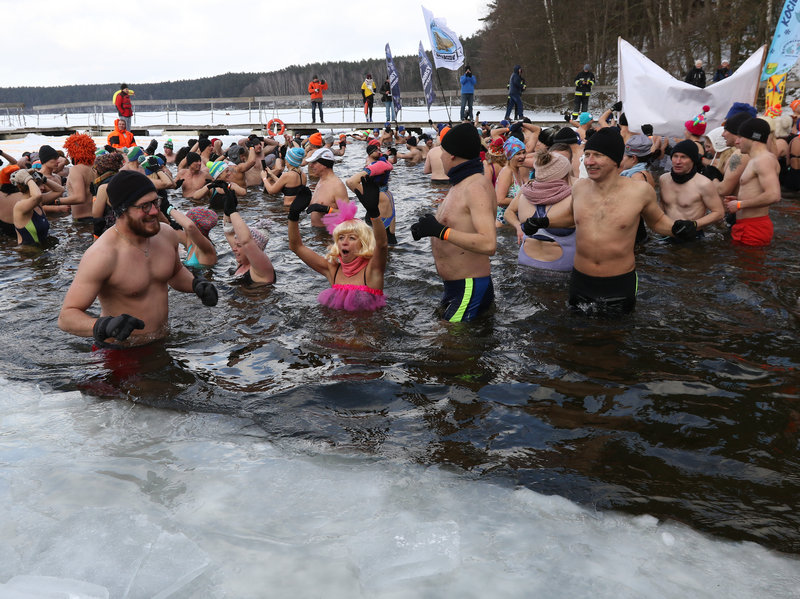 Winter swimmers enjoyed an icy dip in Poland's Garczyn lake last February. Recorded air temperature was around 14 degrees Farenheit, and a large ice hole had to be cut to allow the lake bathing. NurPhoto/Getty Images