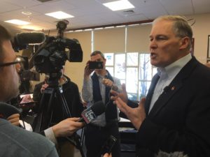 Gov. Jay Inslee speaks with reporters following a talk on climate change at the New Hampshire Institute of Politics in Manchester, Jan. 22, 2019. CREDIT: AUSTIN JENKINS/N3