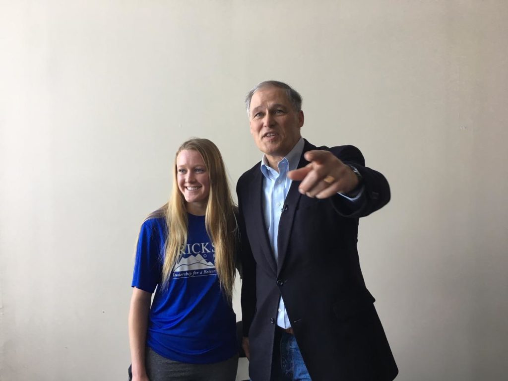 At Dartmouth College, Gov. Jay Inslee took a photo with first-year student Elsa Ericksen, the daughter of Washington Republican state Sen. Doug Ericksen who has often opposed Inslee's climate policies. CREDIT: AUSTIN JENKINS/N3