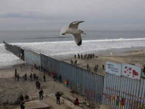 The westernmost edge of the U.S. border wall separates Tijuana from San Diego. Most undocumented immigrants in this country did not enter the U.S. at the Southern border. CREDIT: Rebecca Blackwell/AP