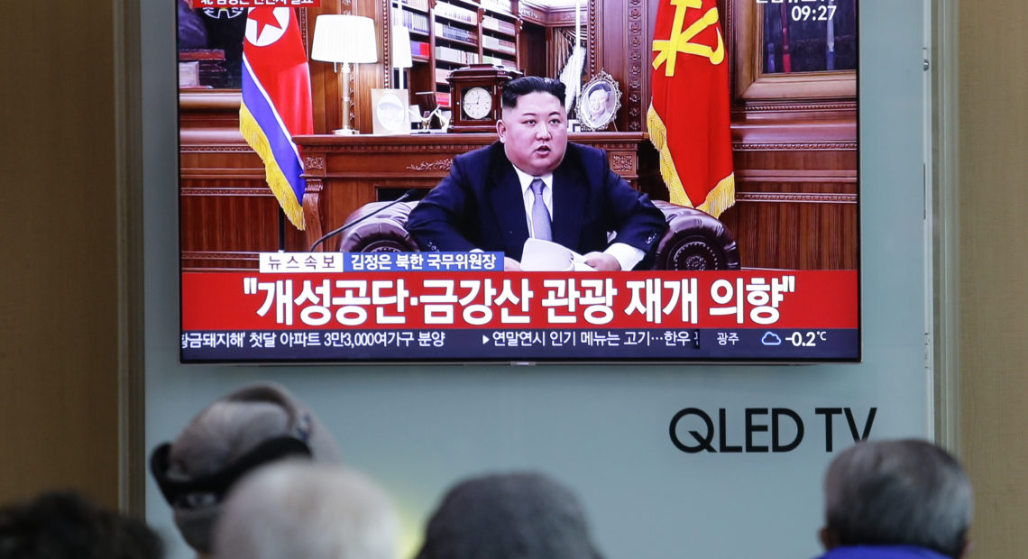 People watch a TV news on a screen showing North Korean leader Kim Jong Un delivering his New Year's speech, at Seoul Railway Station in Seoul, South Korea, on Tuesday. Ahn Young-joon/AP