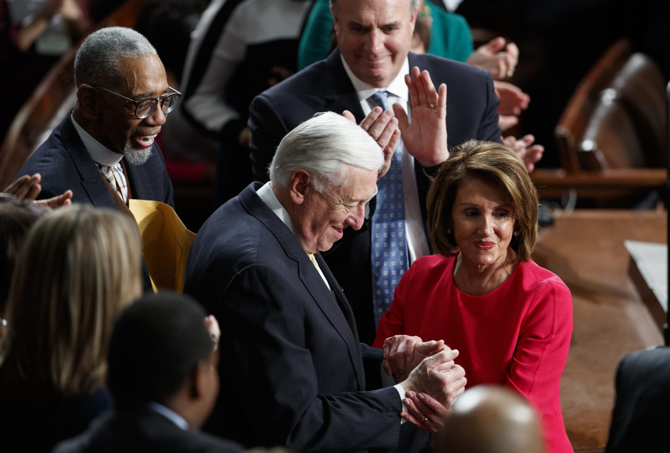 New Speaker of the House Nancy Pelosi, D-Calif., and House Majority Leader Steny Hoyer, D-Md., are applauded at the Capitol on Thursday as Democrats officially regain control of the chamber. CREDIT: CAROLYN KASTER/AP