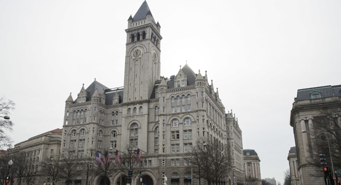 The Old Post Office Pavilion Clock Tower, seen above the Trump International Hotel in Washington, remains open despite the partial government shutdown. CREDIT: Alex Brandon/AP