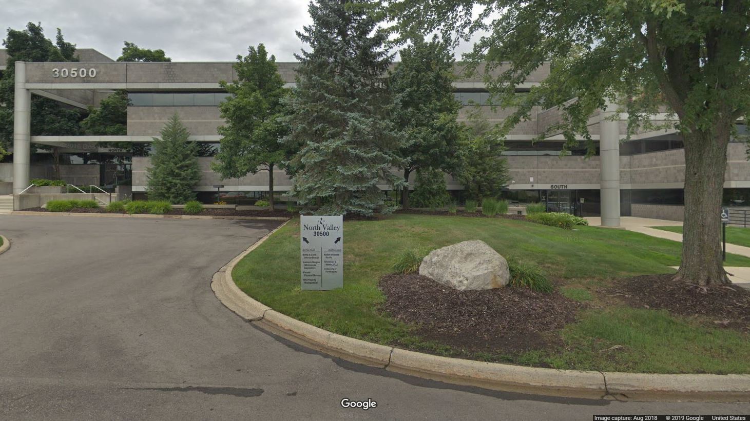 The "University of Farmington" occupied office space in this building in Farmington Hills, Mich. In court documents, eight men are accused of recruiting hundreds of "students" to the bogus school. CREDIT: GOOGLE MAPS
