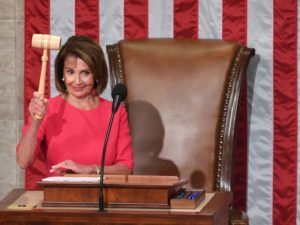 Speaker of the House Nancy Pelosi, D-Calif., holds the gavel after being sworn in on Thursday. CREDIT: SAUL LOEB/AFP/GETTY IMAGES