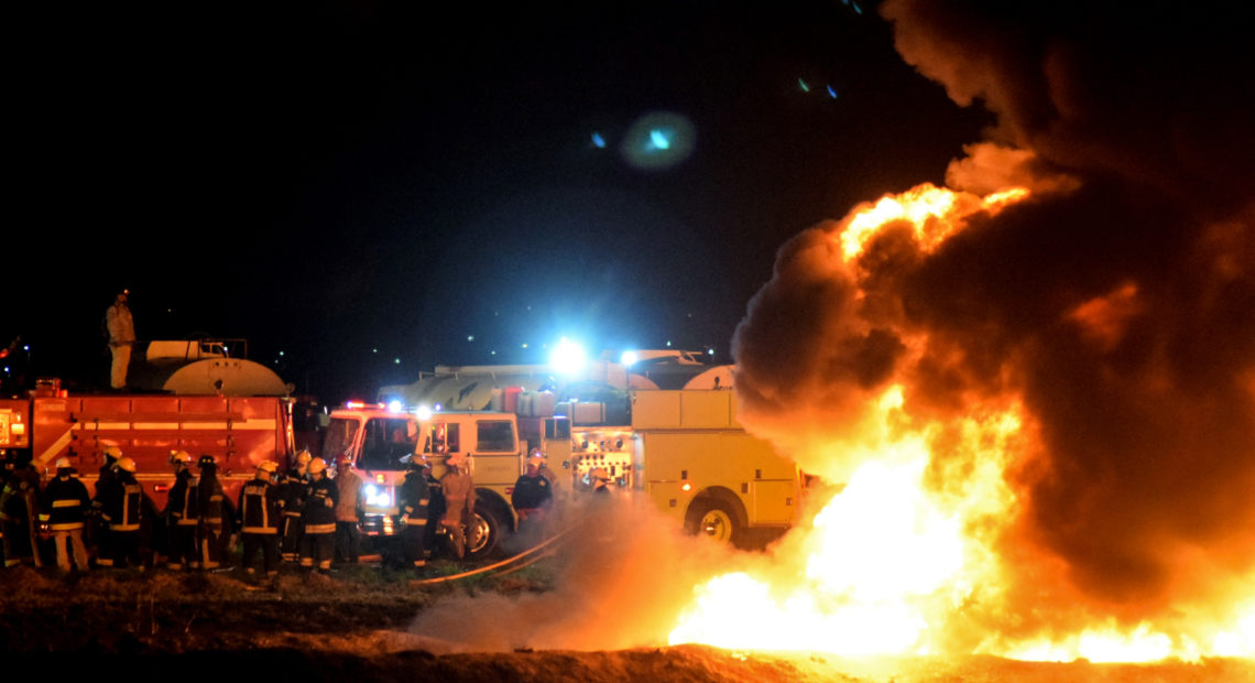 Firefighters work to extinguish a massive blaze triggered by a leaking pipeline in Tlahuelilpan, Mexico on Friday night. At least 66 people were killed. Francisco Villeda/AFP/Getty Images