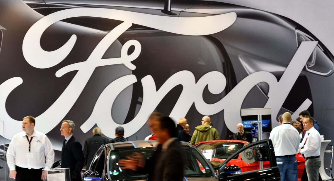 People at the Ford display at the Essen Motor Show fair in Essen, Germany, in December 2017. The automaker has announced it will be cutting some jobs in Europe to reduce costs. Patrik Stollarz/AFP/Getty Images