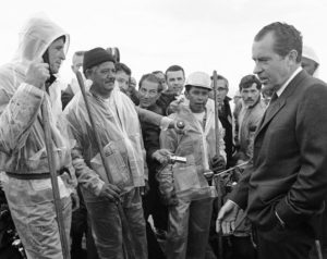 President Richard Nixon talked with workers cleaning up the oily beach at Santa Barbara in March 1969. CREDIT: AP