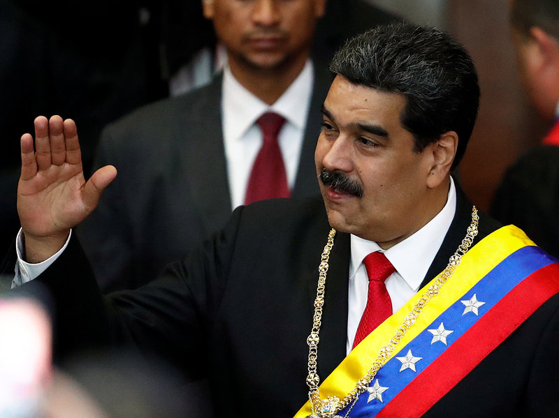 Venezuela's sitting president, Nicolás Maduro, attends a ceremony Thursday in Caracas to mark the opening of the judicial year at the Supreme Court of Justice. Opposition leader Juan Guaidó has declared himself the interim president, but Maduro has not ceded power. CREDIT: CARLOS GARCIA RAWLINS/REUTERS