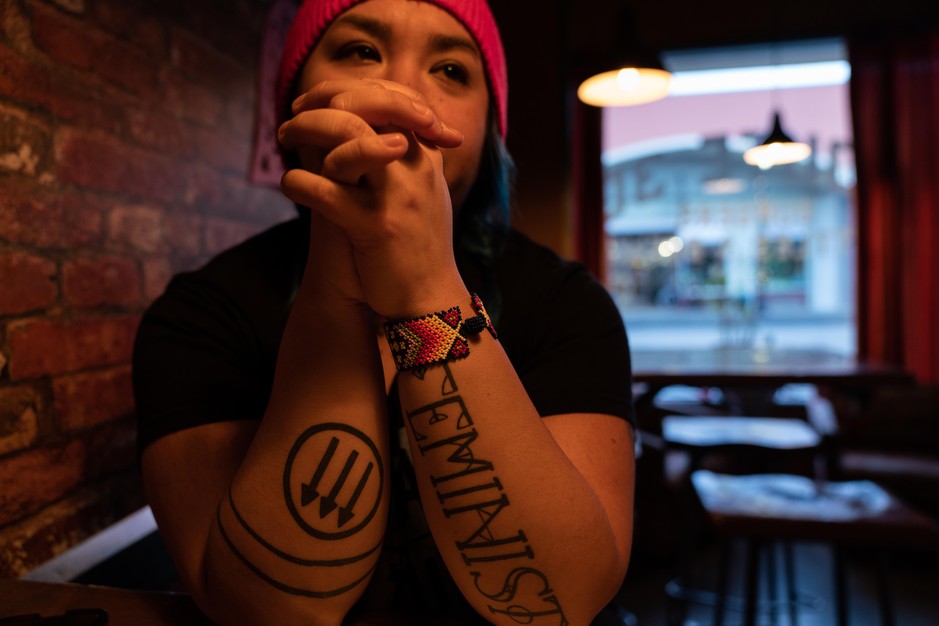 Rosie Strange sits in a restaurant after the Women’s March on Jan. 19, 2019 in The Dalles, Ore. Her left arm says 