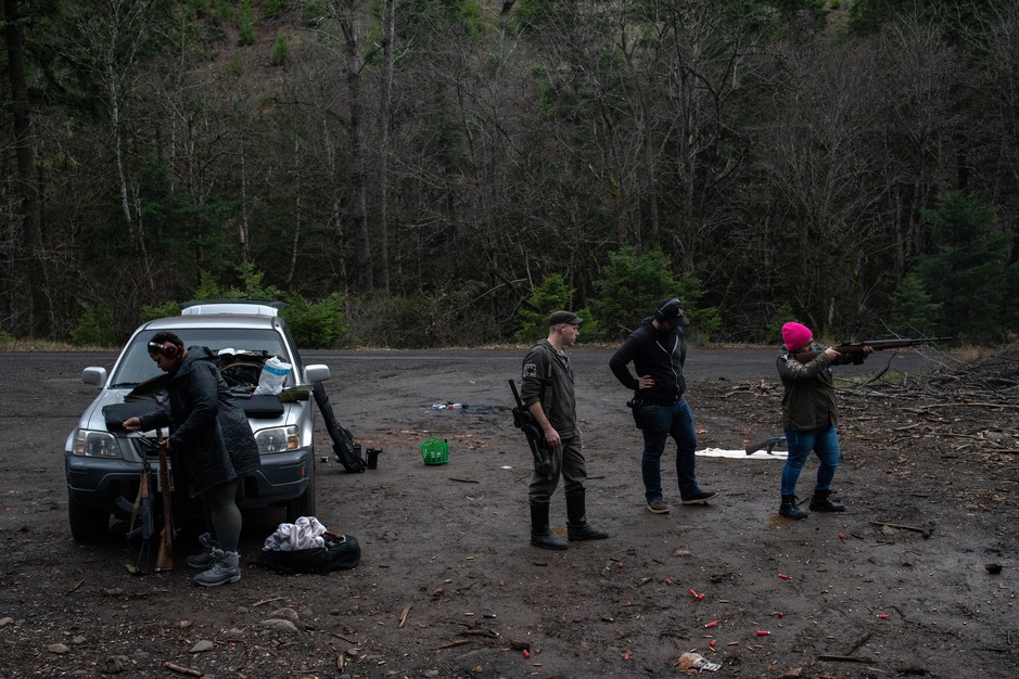 Ross Eliot (center, left) and Rosie Strange (right) take target practice with other activists on Feb. 2, 2019 in Hood River, Ore. CREDIT: JONATHAN LEVINSON/OPB