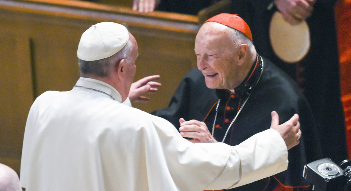 Pope Francis embraces then-Cardinal Theodore McCarrick during a 2015 visit to the U.S. McCarrick resigned the cardinalate last year before being defrocked Feb. 16, 2019. CREDIT: Jonathan Newton/AP