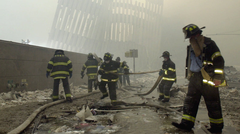 Firefighters work at Ground Zero, the site of the World Trade Center attacks, on Sept. 11, 2001. CREDIT: Mark Lennihan/AP