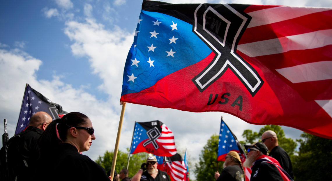 The National Socialist Movement, a neo-Nazi group that has been designated a hate group by the Southern Poverty Law Center, held a rally in Newnan, Ga., in April 2018. CREDIT: David Goldman/AP