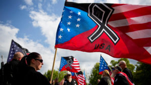 The National Socialist Movement, a neo-Nazi group that has been designated a hate group by the Southern Poverty Law Center, held a rally in Newnan, Ga., in April 2018. CREDIT: David Goldman/AP