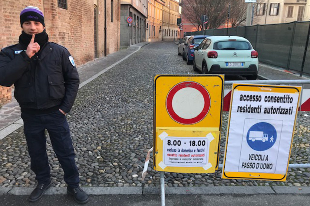 A security guard blocks off the recording area outside the Violin Museum in Cremona, Italy. CREDIT: Chris Livesay for NPR