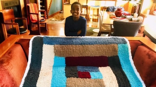 Eleven-year-old Jonah Larson's favorite hobby is crocheting, which he turned into a business. He made this blanket in January 2019 during a snow day from school. Courtesy of Jennifer Larson