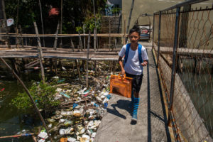 Around the globe, people are searching for ways to reduce plastic waste. Above: Dampalit, a fishing community in Manila Bay, can't keep up with a constant influx of trash. CREDIT: JES AZNAR/NPR