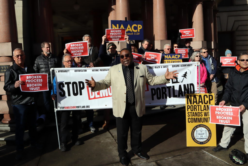 Upset building owners joined a protest rally outside Portland City Hall Wednesday organized by Save Portland Buildings and the NAACP. CREDIT: TOM BANSE / NW NEWS NETWORK
