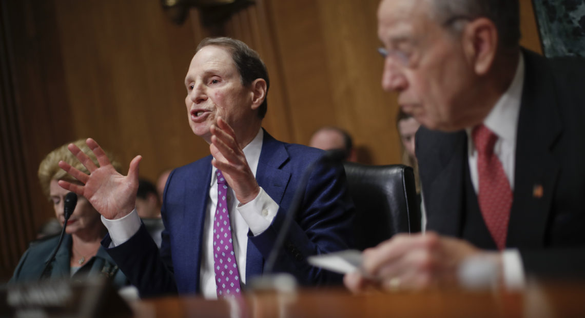 Sen. Ron Wyden, D-Ore., left, and Sen. Chuck Grassley, R-Iowa, right, chairman of the Senate Finance Committee, asked drug company CEOs some tough questions about drug prices on Tuesday during a hearing before the Senate Finance Committee. CREDIT: PABLO MARTINEZ MONSIVAIS/AP