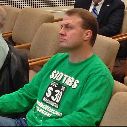 In this file photo, Tim Eyman sits in a legislative committee hearing. AUSTIN JENKINS / NORTHWEST NEWS NETWORK