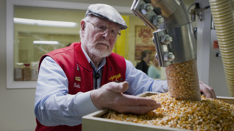 Bob Moore, founder of Bob's Red Mill and Natural Foods, inspects grains at the company's facility in Milwaukie, Ore. The pioneering manufacturer of gluten-free products invests in whole grains as well as beans, seeds, nuts, dried fruits, spices and herbs. CREDIT: Natalie Behring/Bloomberg via Getty Images