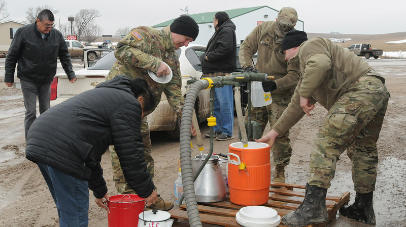 National Guard members distribute drinkable water to residents of Sharps Corner, a community in the Pine Ridge Reservation in S.D. Courtesy of Lt. Col. Anthony Deiss, South Dakota National Guard