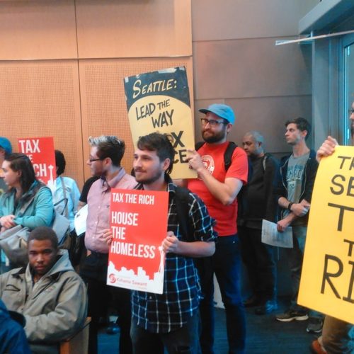 People pack Seattle City Hall in June 2017 for a meeting about whether to enact an income tax. CREDIT: KATE WALTERS/KUOW