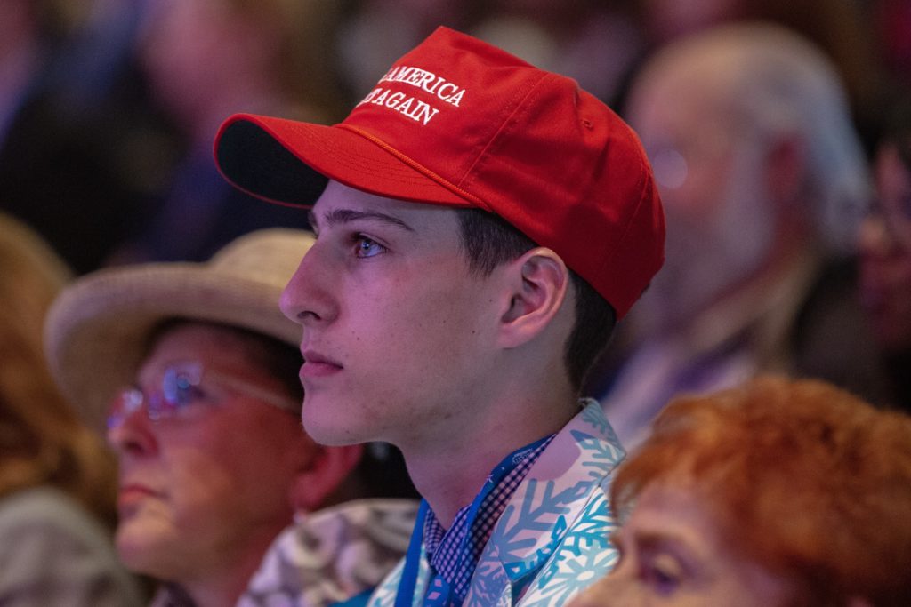 A young supporter in the crowd wears a "Make America Great Again" hat. Donald Trump's 2016 campaign slogan is the clear message of the CPAC. CREDIT: Amr Alfiky/NPR