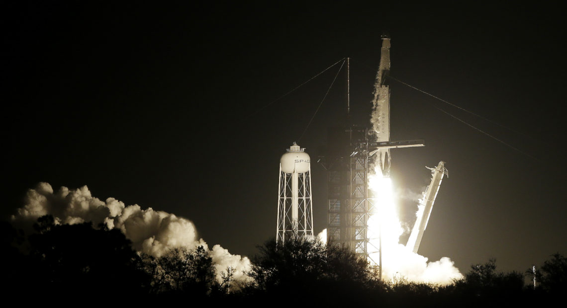 A SpaceX Falcon 9 rocket and Crew Dragon capsule lifts off from pad 39A on Saturday in Cape Canaveral, Fla. Terry Renna/AP