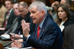 Wells Fargo CEO Timothy Sloan is questioned by the House Financial Services Committee earlier this month. He will step down immediately, the company announced Thursday. J. Scott Applewhite/AP