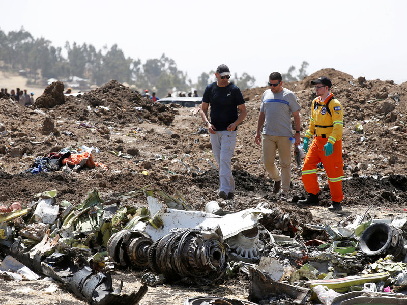 Relatives of the 157 people who died in Sunday's crash of a Boeing 737 Max 8 were allowed to visit the site of the disaster Wednesday. Ethiopian Airlines says its pilot was well-trained — and that he had reported trouble with the jetliner's flight controls just before the plane went down. CREDIT: BAZ RATNER/REUTERS