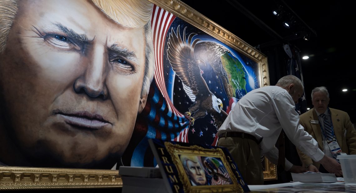 The 8-by-16-foot painting of President Trump by artist Julian Raven is on display at the Conservative Political Action Conference in National Harbor, Md. CREDIT: Amr Alfiky/NPR
