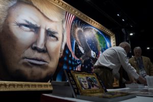 The 8-by-16-foot painting of President Trump by artist Julian Raven is on display at the Conservative Political Action Conference in National Harbor, Md. CREDIT: Amr Alfiky/NPR