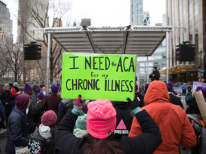 The Justice Department sent a letter in support of repealing the entirety of the Affordable Care Act. Here, a sign in support of the ACA in April 2017 in New York City. Kevin Hagen/Getty Images
