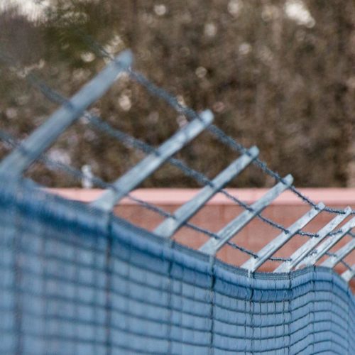 A barbed wire fence encloses the Columbia County Jail yard in St. Helens, Ore., Saturday, March 30, 2019. CREDIT: Bradley Parks/OPB