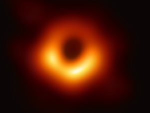 The first-ever image of a black hole was released Wednesday by a consortium of researchers, showing the "black hole at the center of galaxy M87, outlined by emission from hot gas swirling around it under the influence of strong gravity near its event horizon." CREDIT: Event Horizon Telescope collaboration et al