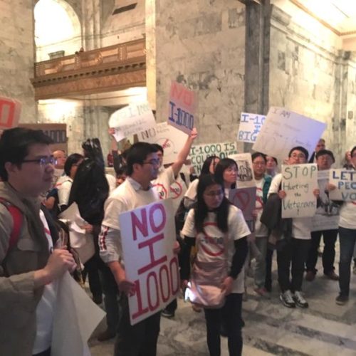 Affirmative action opponents demonstrate outside the Washington Senate on Sunday night following a vote to approve I-1000. AUSTIN JENKINS/N3