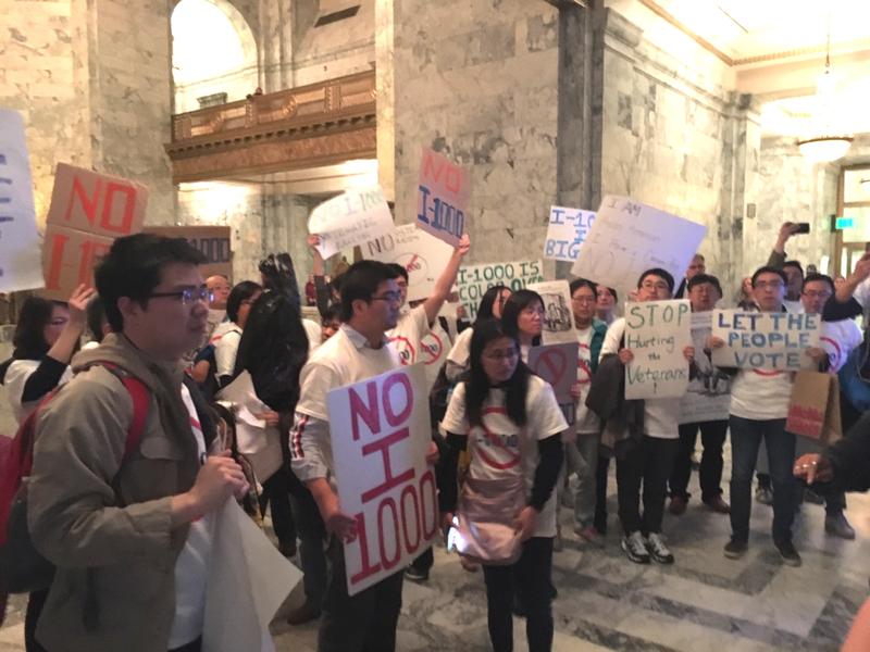 Affirmative action opponents demonstrate outside the Washington Senate on Sunday night following a vote to approve I-1000. AUSTIN JENKINS/N3