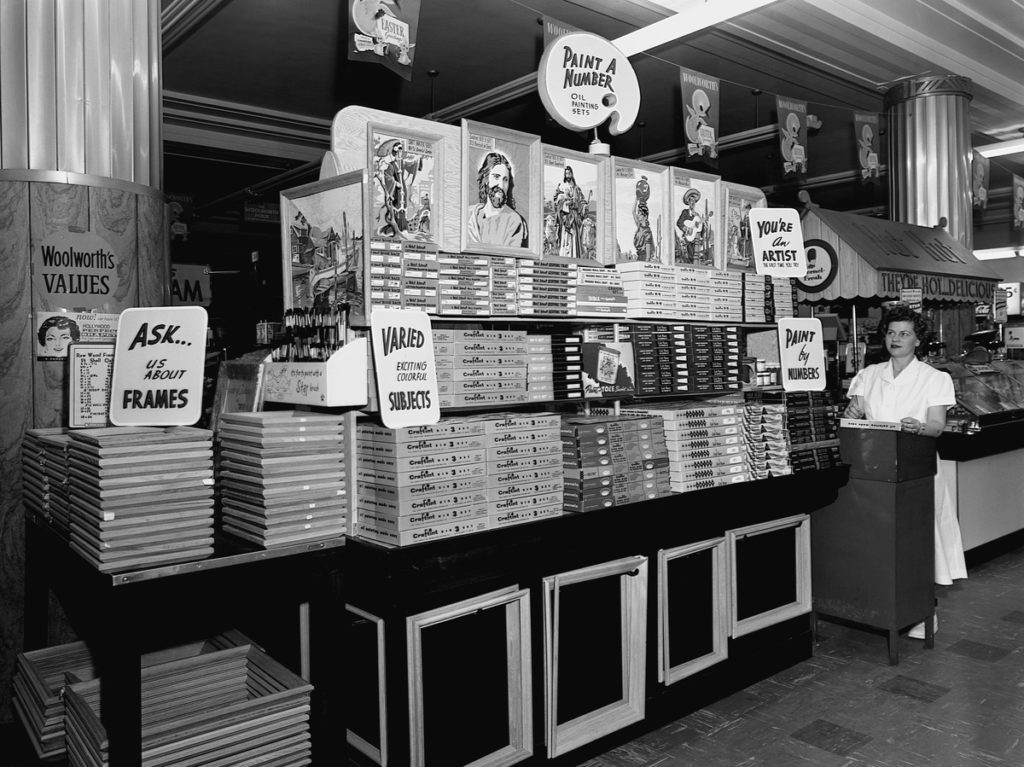 A saleswoman at Woolworth's Five and Dime store sells paint-by-number kits -- after World War II, people had more leisure time to paint, and the kits took off. CREDIT: Minnesota Historical Society/Corbis via Getty Images