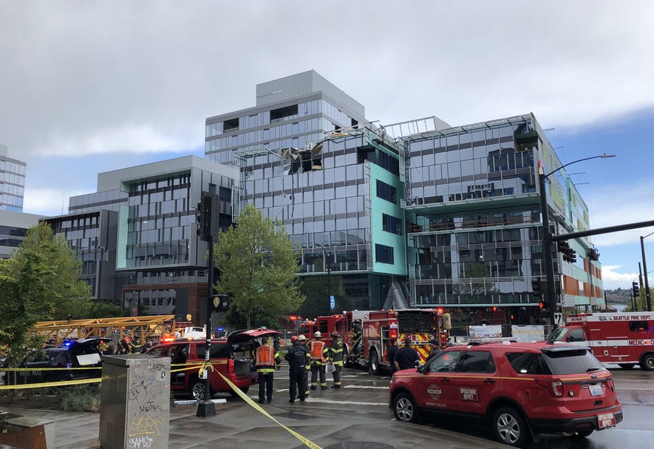 The scene an hour after a crane collapsed on a building at the corner of Fairview and Mercer in downtown Seattle, leaving four dead and three wounded. Among those wounded was a mother and child.