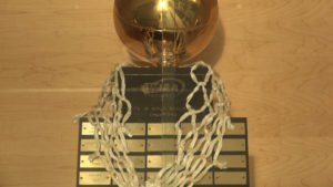 The State 1B Girls' Basketball Champions trophy in a trophy case at Colton High School.