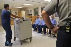 In Massachusetts last July, several Franklin County Jail inmates were watched by a nurse and a corrections officer after receiving their daily doses of buprenorphine, a drug that helps control opioid cravings. By some estimates, at least half to two-thirds of today's U.S. jail population has a substance use or dependence problem. CREDIT: ELISE AMENDOLA/AP
