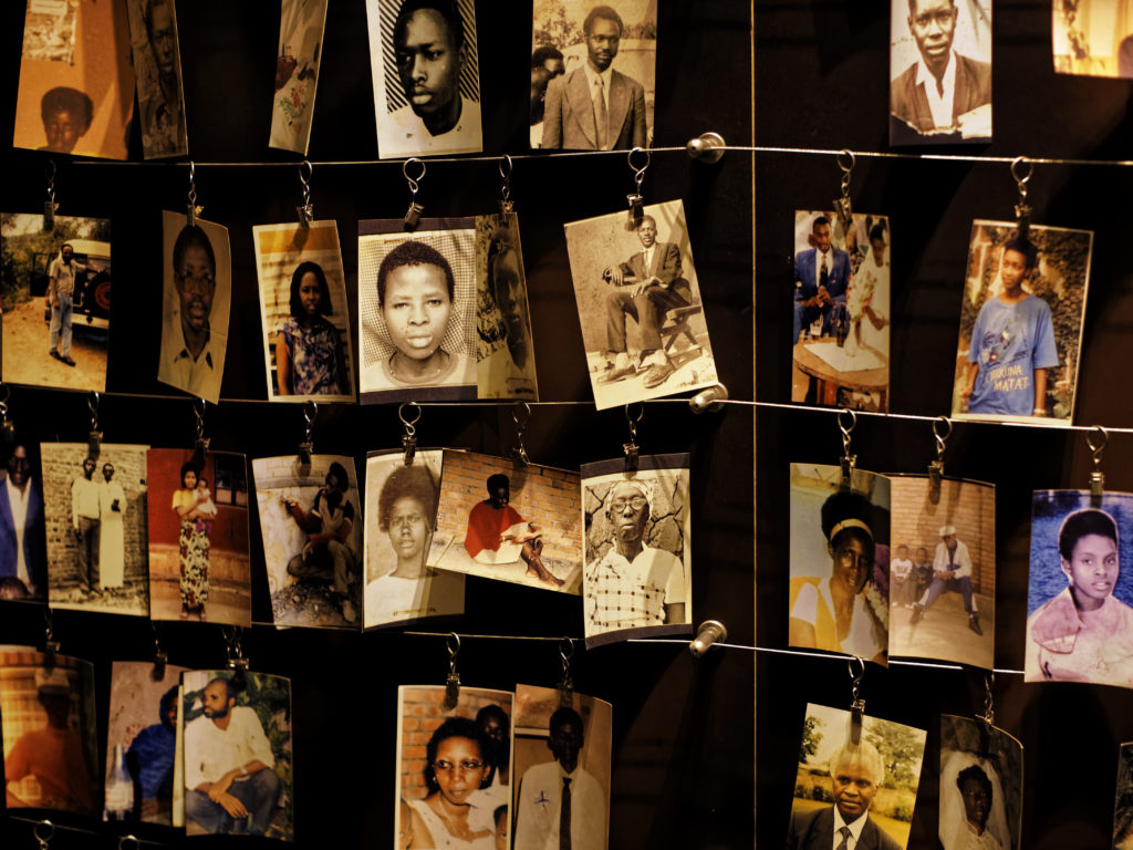 Family photographs of some of those who died hang on display in an exhibition at the Kigali Genocide Memorial center on Friday. Ben Curtis/AP