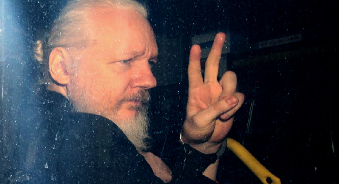 WikiLeaks founder Julian Assange arrives in a police vehicle at Westminster Magistrates court on Thursday in London. He was arrested by Scotland Yard police officers inside the Ecuadorian Embassy in Central London. Jack Taylor/Getty Image
