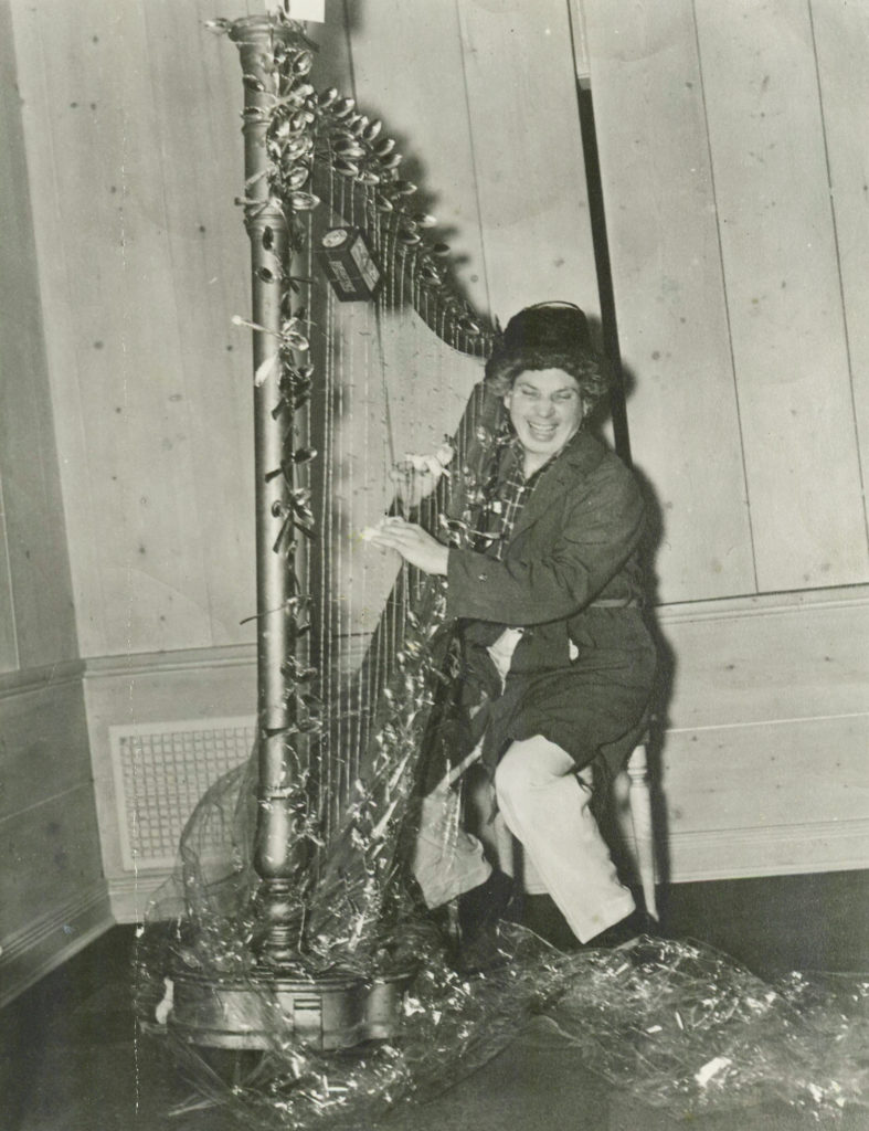Harpo Marx with the surrealist harp sent to him by Salvador Dalí. Courtesy of Marx Family